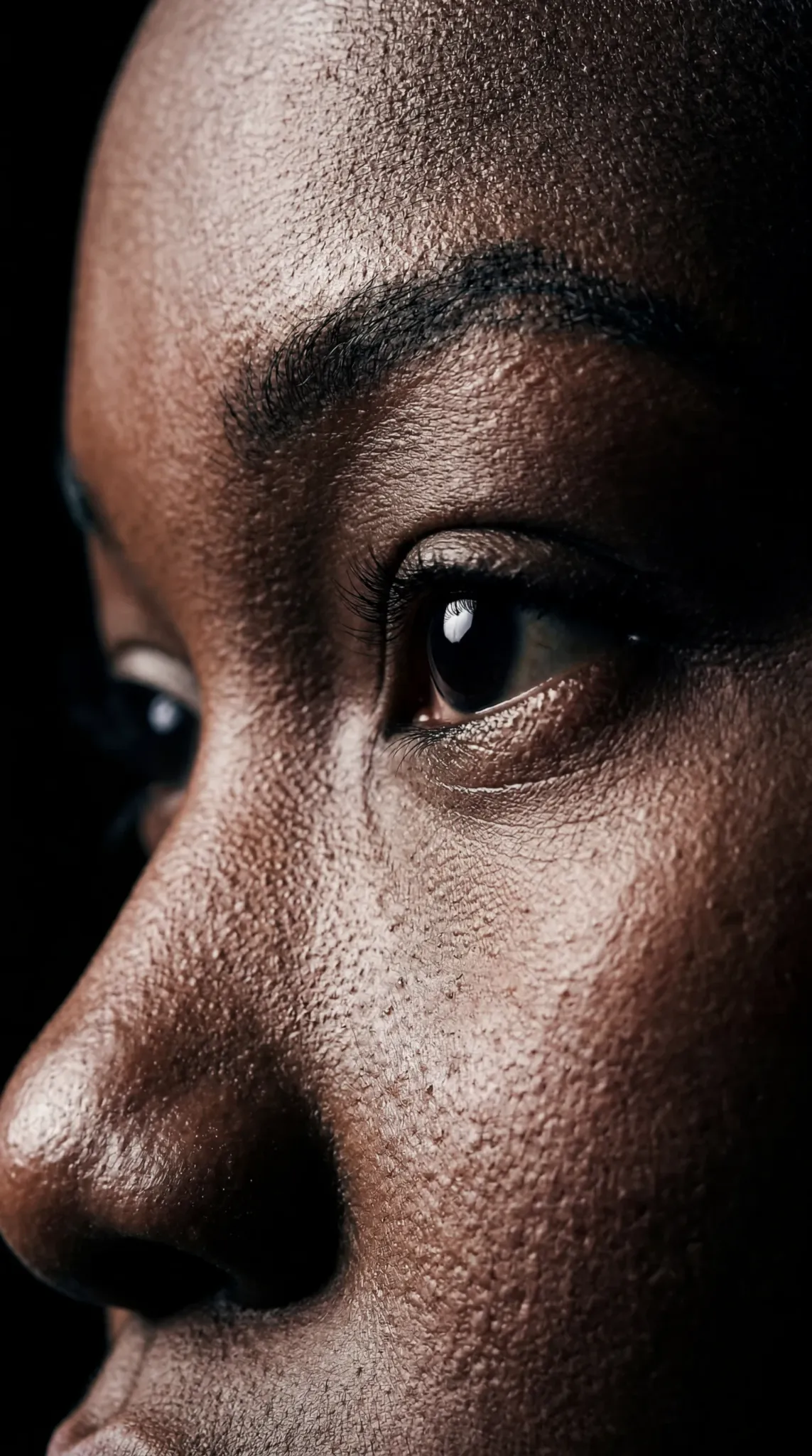 Extreme beauty portrait highlighting skin and eye detail