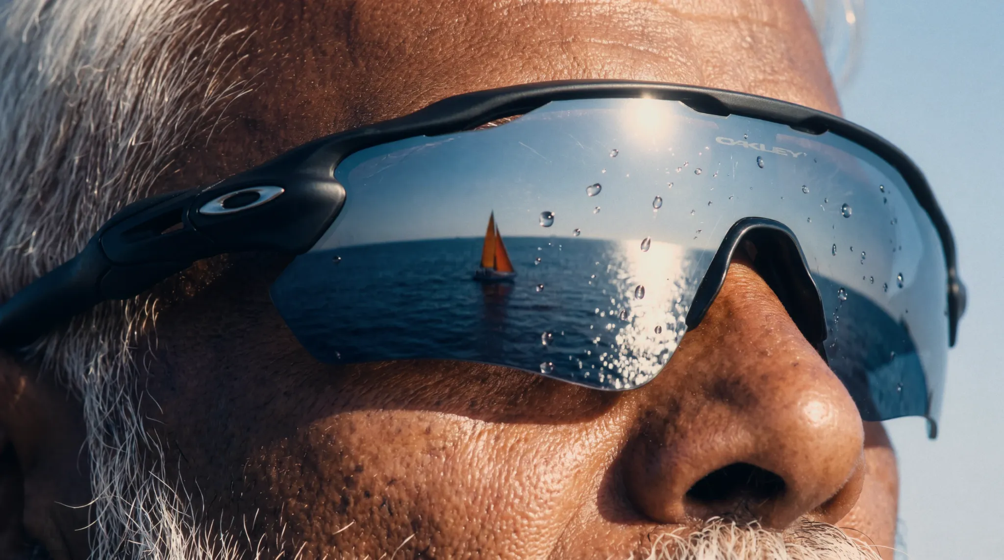 Close portrait reflected in Oakley sunglasses