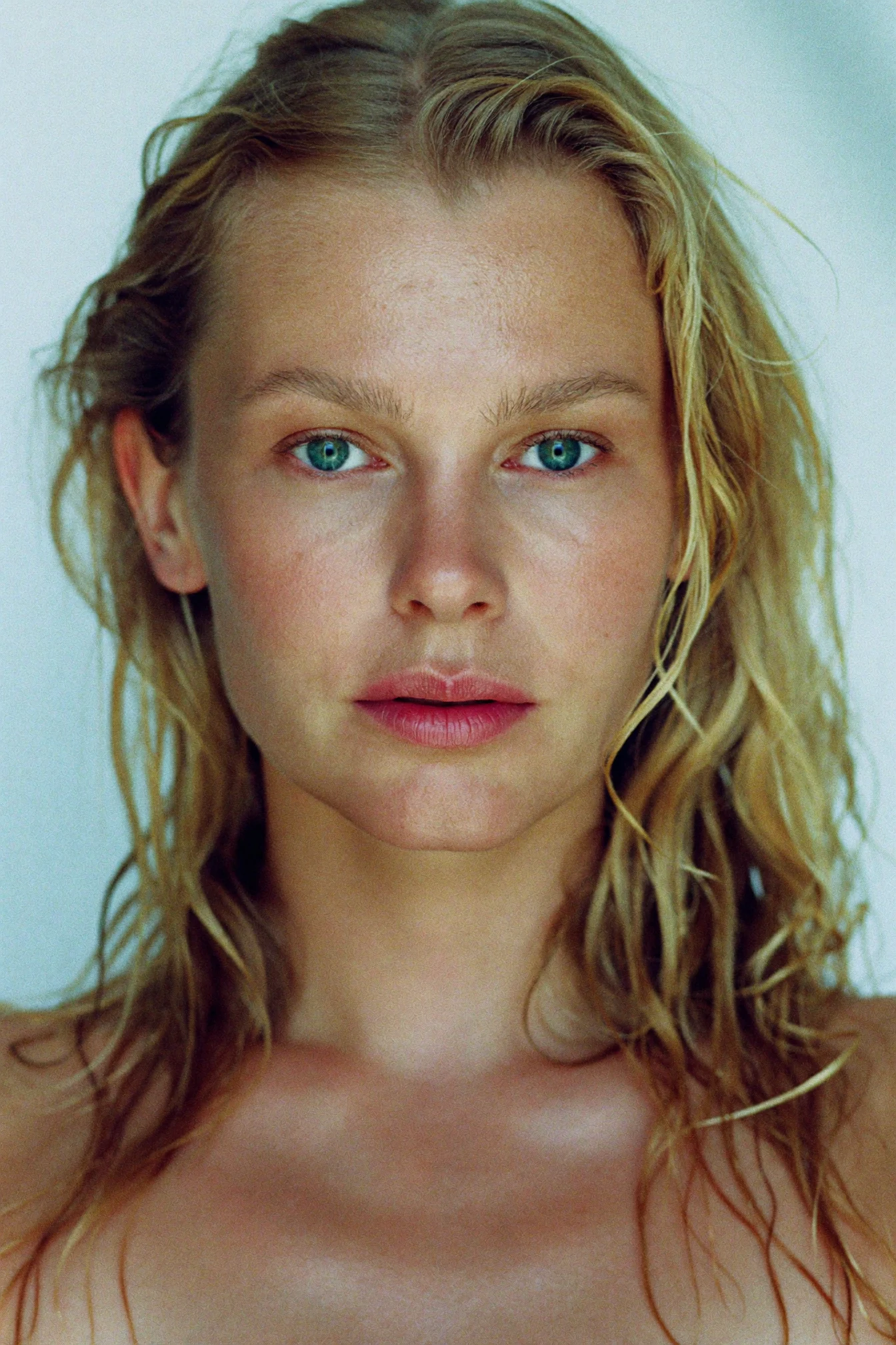 Grain-textured frontal beauty portrait